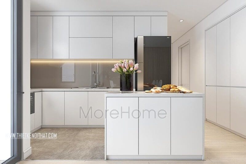 Tủ bếp trắng hiện đại được thiết kế để tạo ra sự liền mạch trong mẫu thiết kế nội thất chung cư đẹp này và cung cấp nhiều tiện nghi.